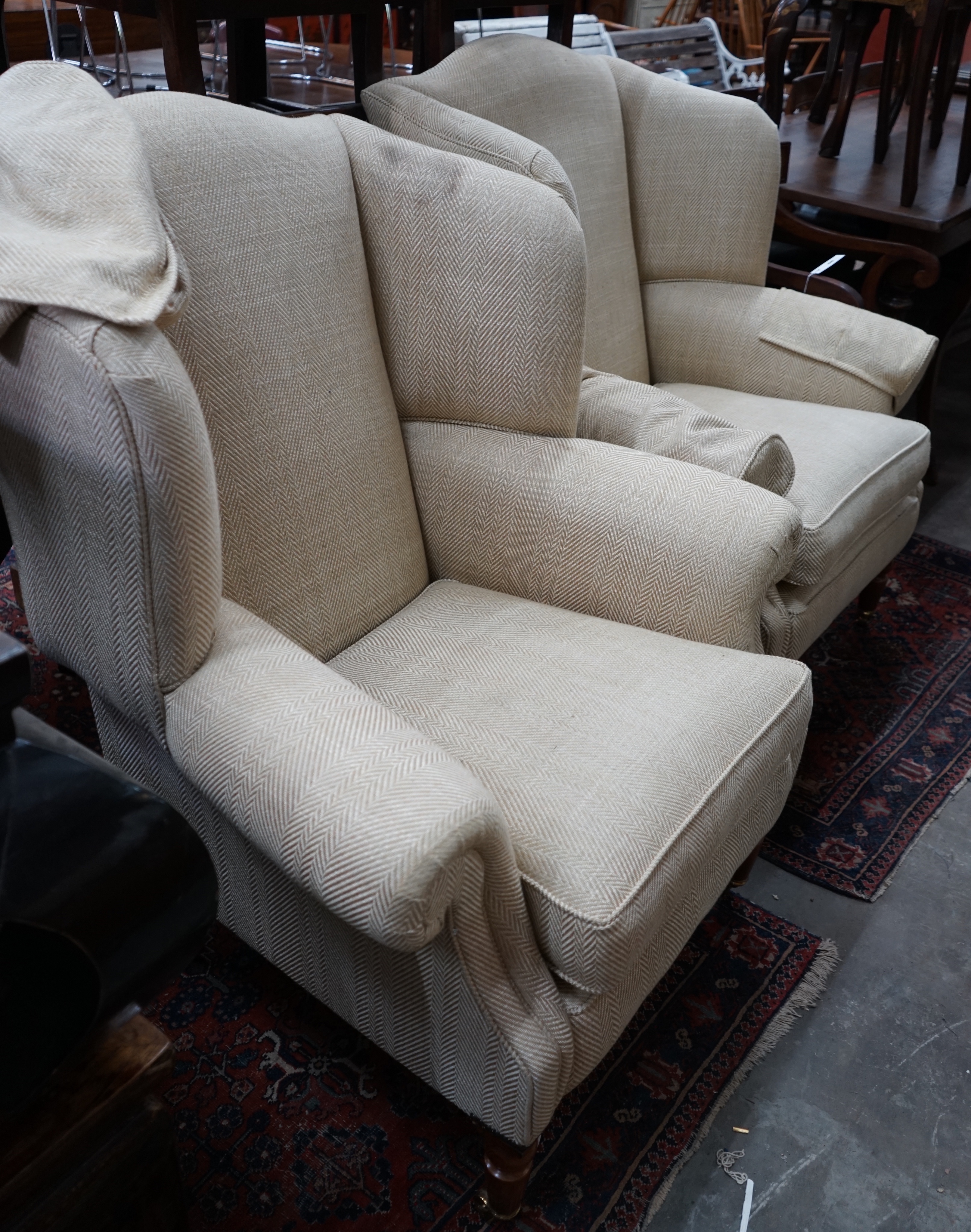 A pair of Duresta wing armchairs, upholstered in a natural herringbone fabric, width 92cm depth 80cm height 114cm